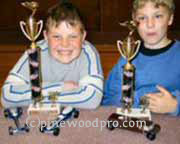 pinewood derby winners with trophy's