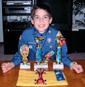 pinewood derby winner with trophy picture