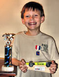 pinewood derby winner with trophy 