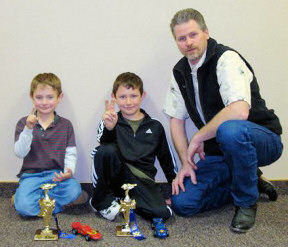 Awana Clubs Father with pinewood derby winners