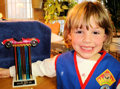 pinewood derby winner with trophy picture pinewood derby winner with trophy picture