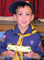 cub scout with Swiss Cheese derby car