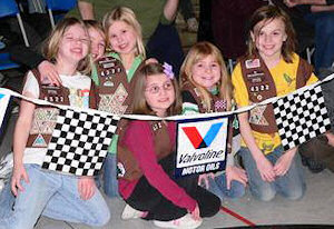 Girl Scouts cheering for Pinewood Derby