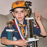 pinewood derby winner with trophy picture