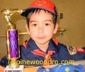 cub scout winner with trophy and car