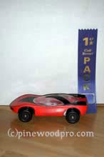 Pinewood derby winning car with ribbon