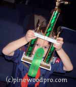 cube scout looking at trophy cub scout looking at trophy