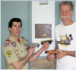 pinewood derby plaque on wall outside the ScoutHouse