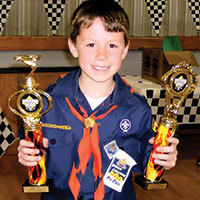 Pinewood Derby Winner with Trophies